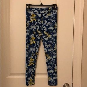 blue and yellow leggings with leaves.